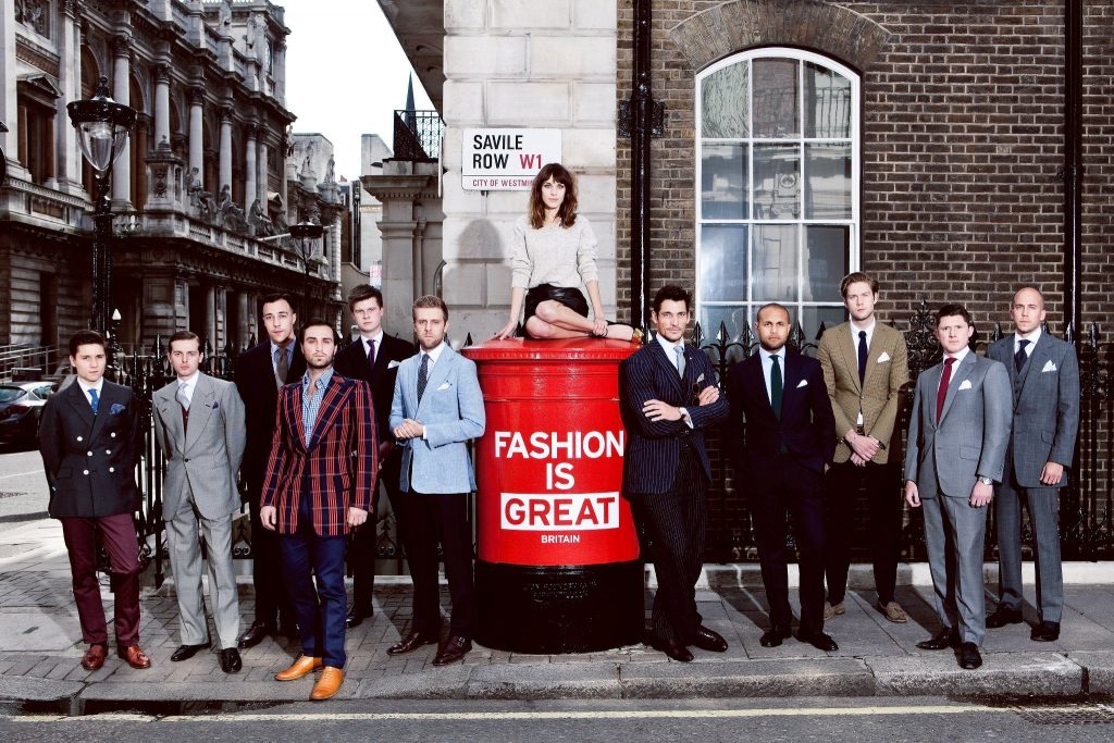Men in suits stood next to post box